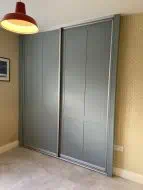 2 door, fjord green sliding wardrobe with twin shaker design, fitted in Barnard Castle (angled photo)